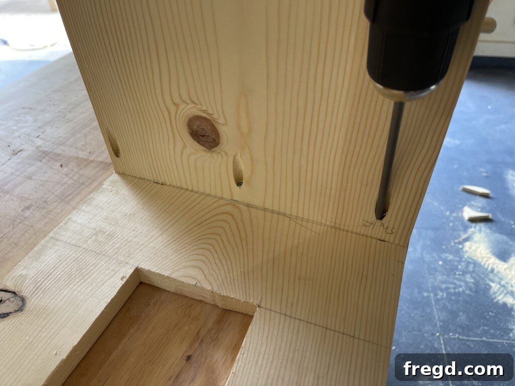Craft a Charming Dollhouse Book Nook 5 Attaching the shelves to the side panels of the dollhouse bookcase using pocket hole screws and wood glue