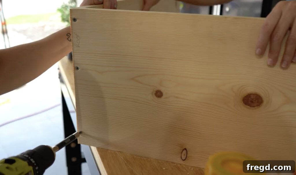 Craft a Charming Dollhouse Book Nook 7 Assembling the mitered roof boards with wood screws and wood glue for the dollhouse bookcase