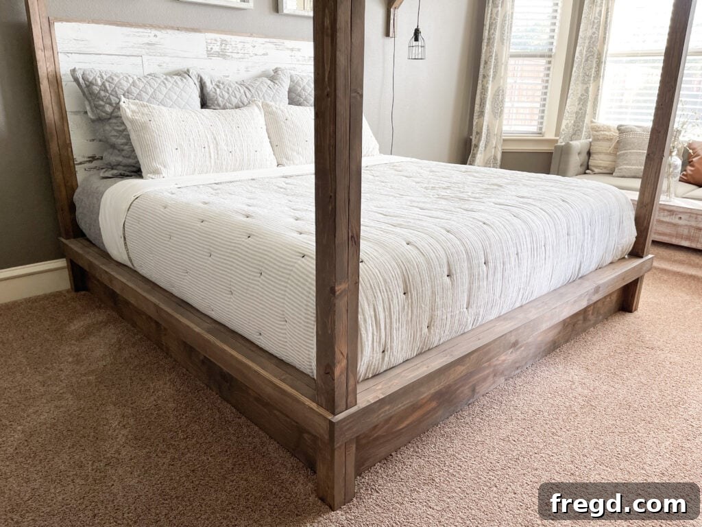 Craft Your Own Canopy Bed 44 Close-up of the DIY canopy bed's headboard and wooden posts