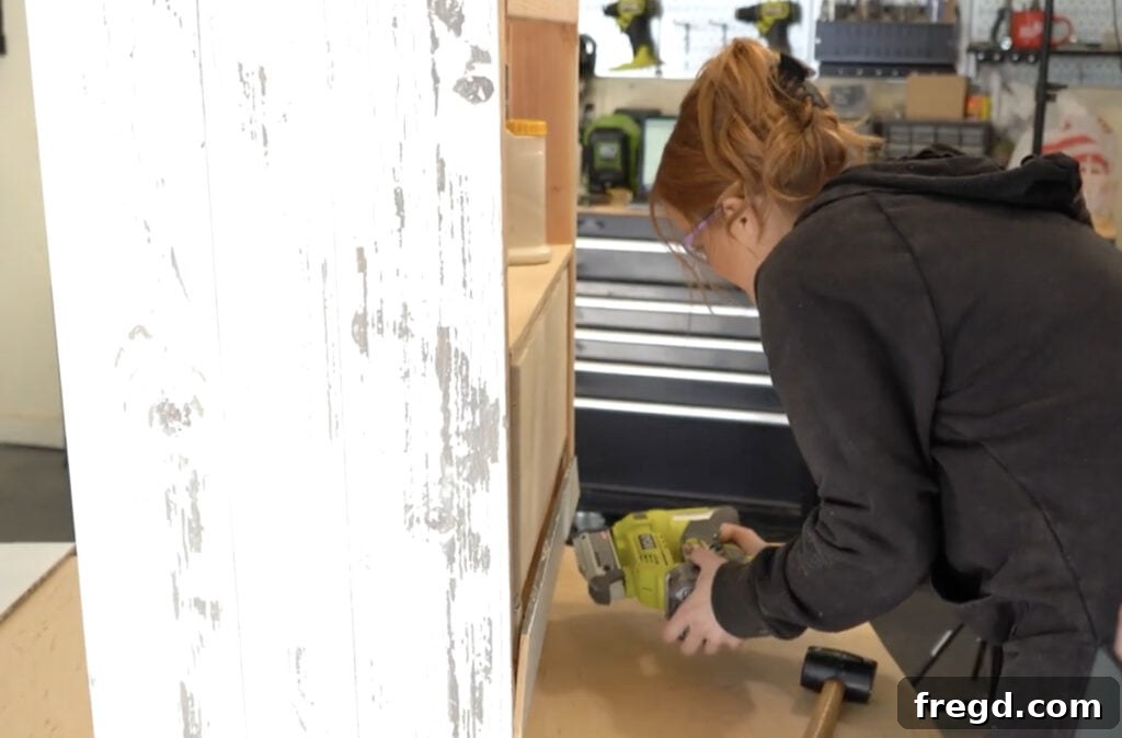 Modern DIY Nightstand with Hidden Storage Drawer 20 Precisely cutting and attaching the front miter trim pieces around the drawer opening