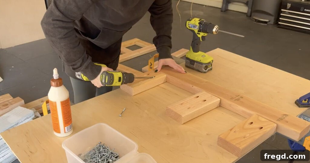 Modern DIY Nightstand with Hidden Storage Drawer 4 Assembling the wooden side frames of the nightstand using pocket hole screws and wood glue