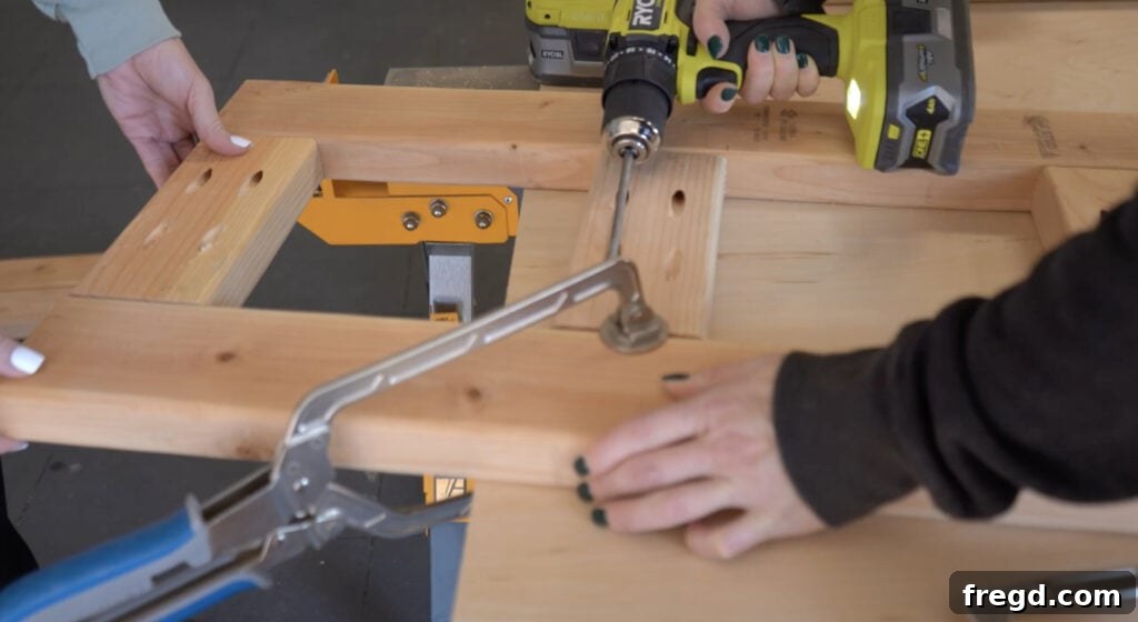 Modern DIY Nightstand with Hidden Storage Drawer 5 Attaching the second leg component to the partially assembled nightstand frame