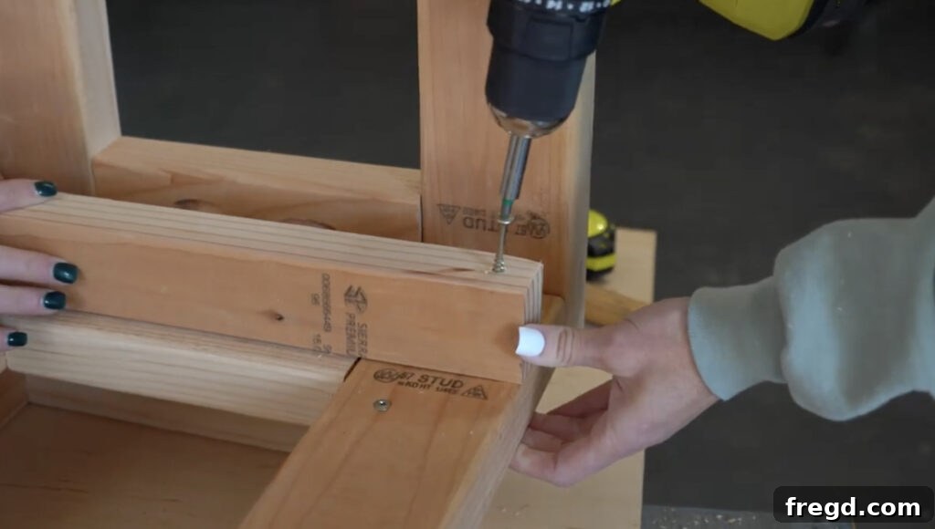 Modern DIY Nightstand with Hidden Storage Drawer 10 Installing wooden cleats inside the nightstand frame, which will support the drawer slides