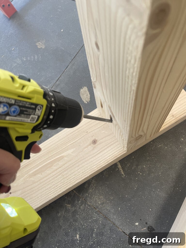 Reinforcing leg-to-support connection with additional wood screws.