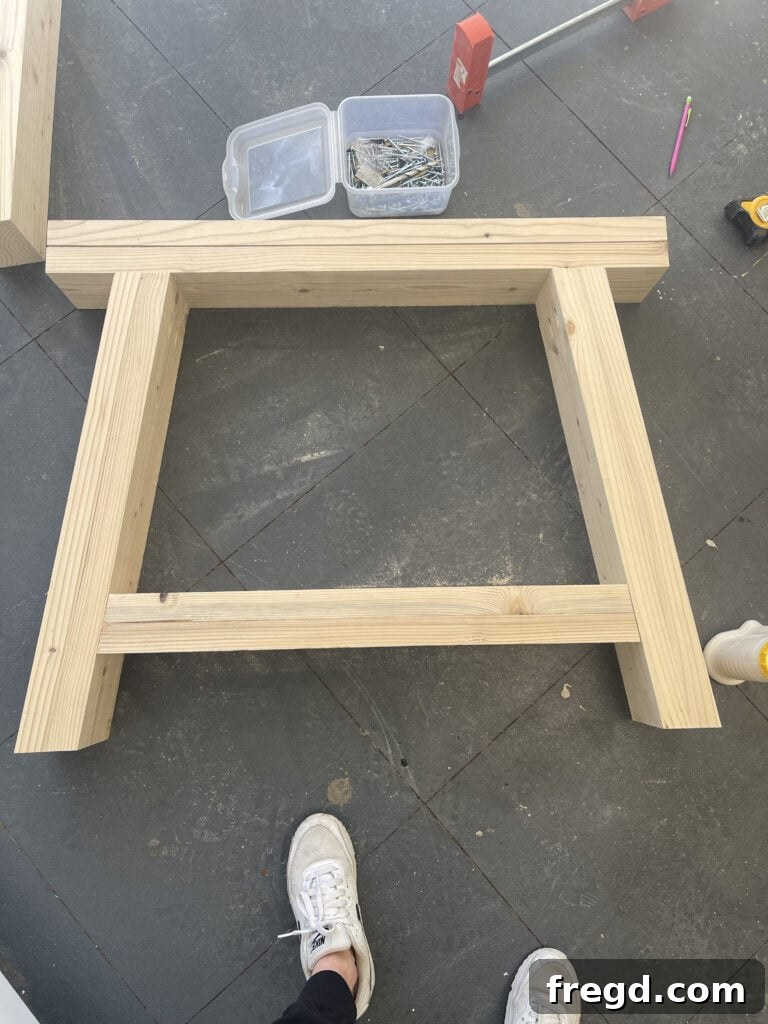 Attaching bottom horizontal supports to leg assemblies.