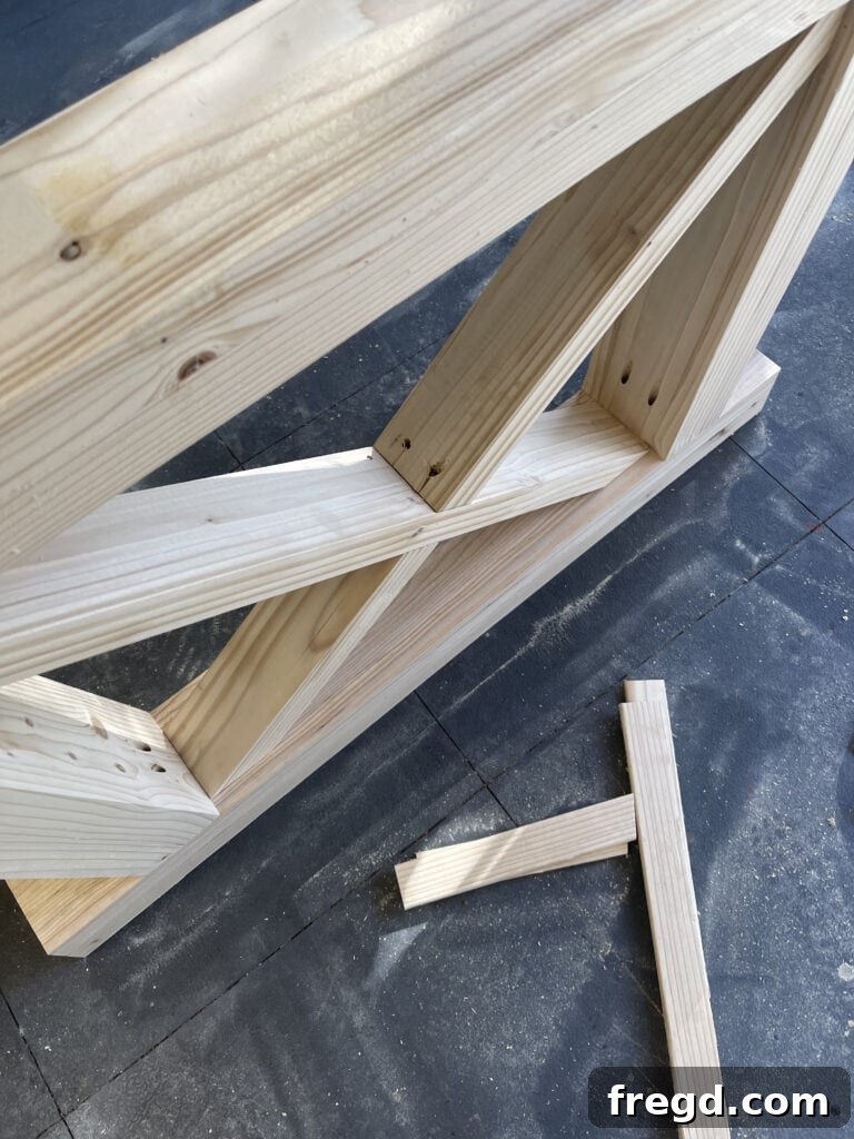 Completed X-bracing within the leg assembly.