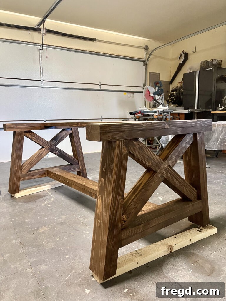 Finished X-base dining table stained with Varathane Dark Walnut.
