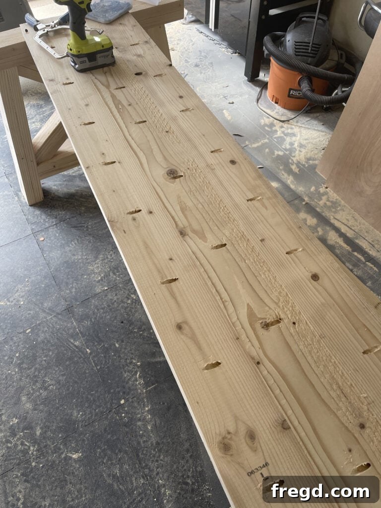 Joining tabletop planks with wood glue and pocket hole screws.