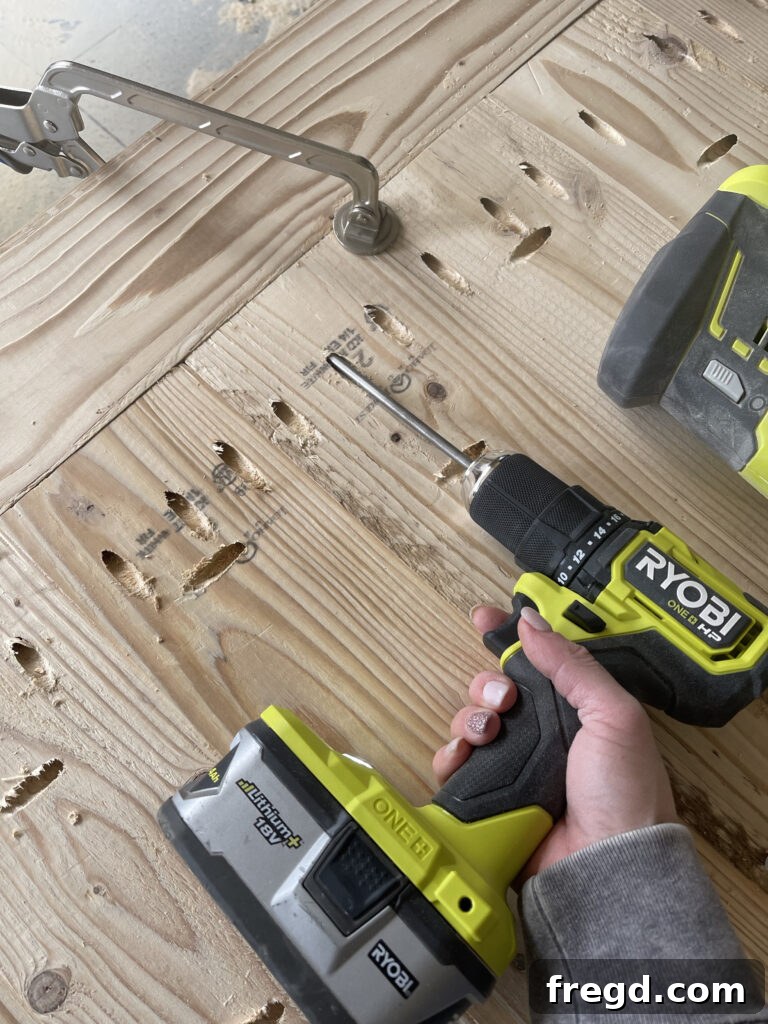 Attaching breadboards to the completed tabletop with pocket holes.