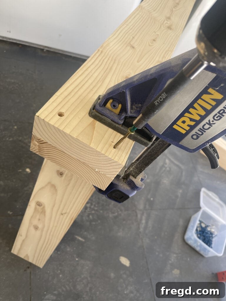 Laminating top horizontal support boards with glue and screws.