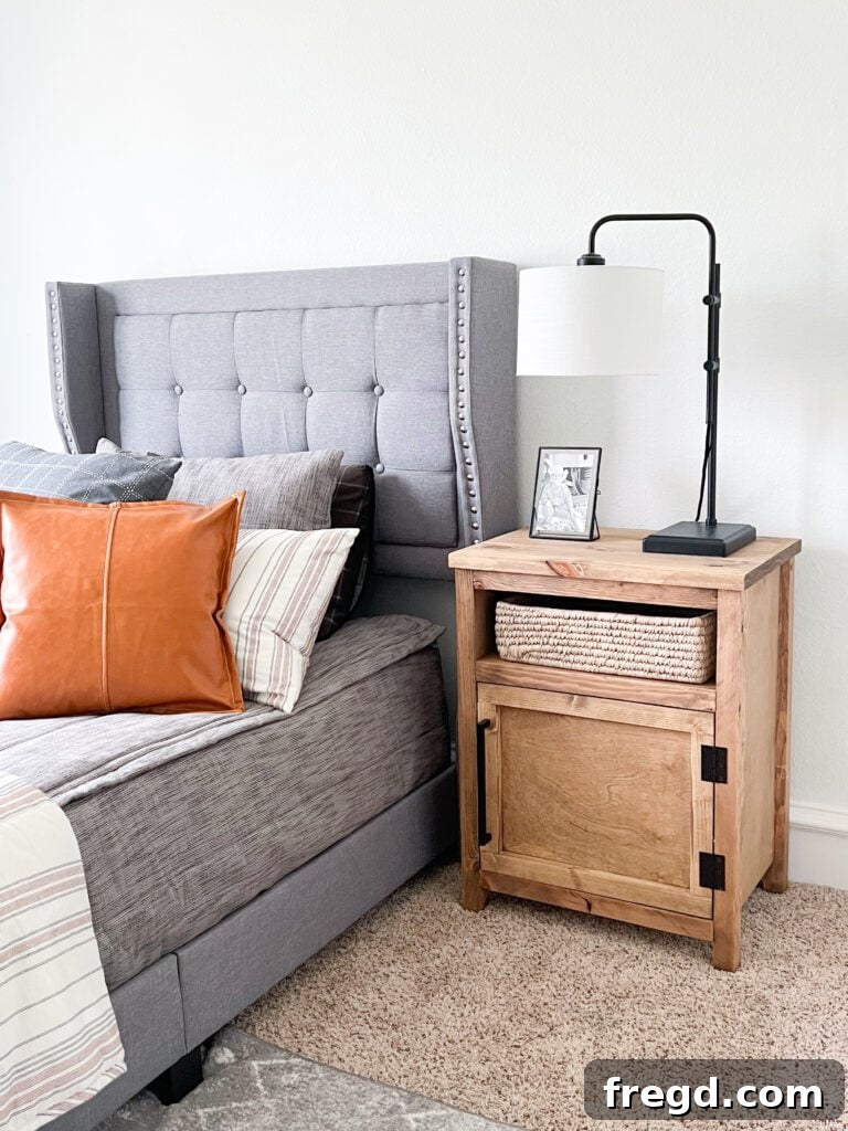 Detailed shot of the Modern Farmhouse Nightstand showing the cabinet and open shelf.