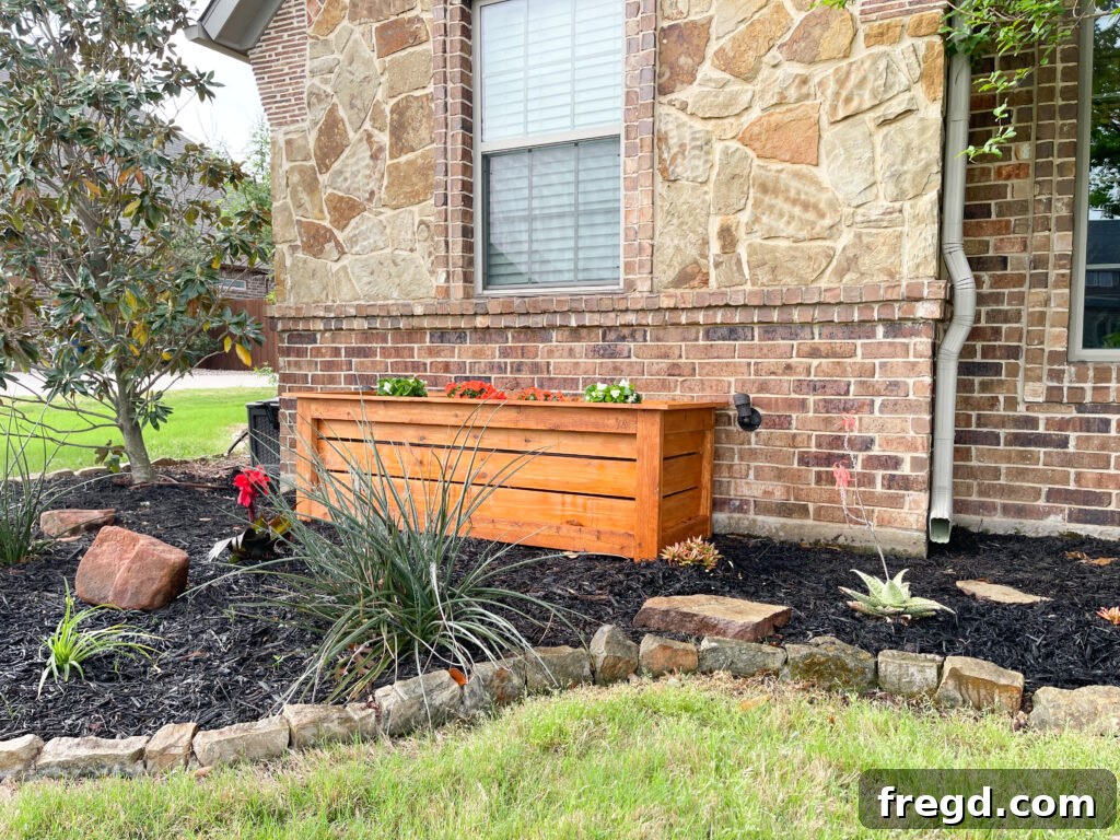Two large cedar planter boxes enhancing the entryway of a home