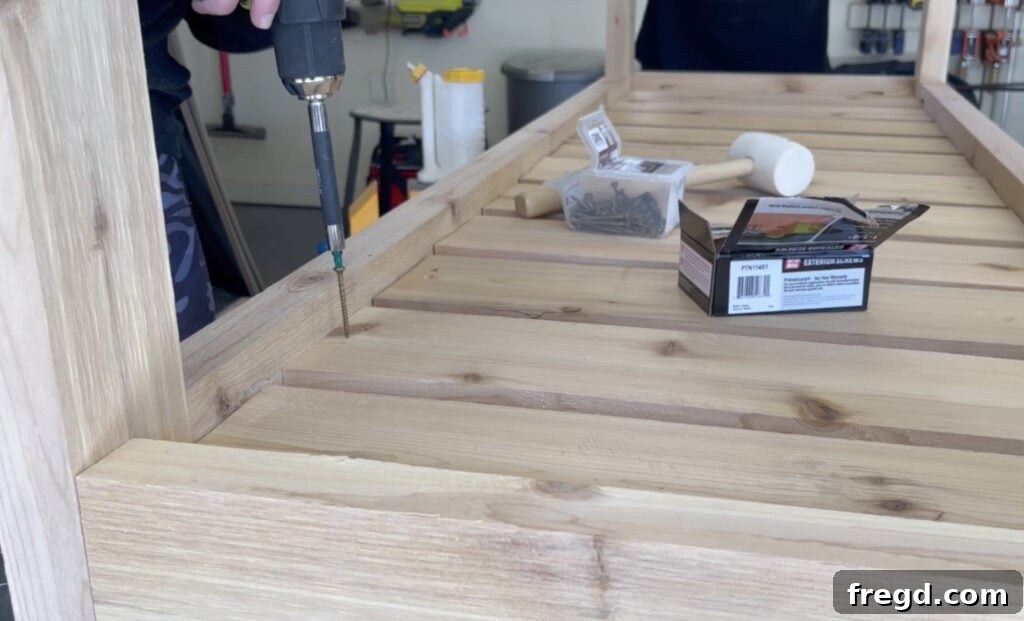 Installing bottom slats with even spacing for drainage