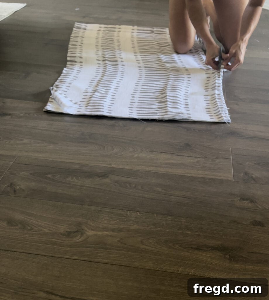Measuring and cutting fabric for the no-sew dog bed cover