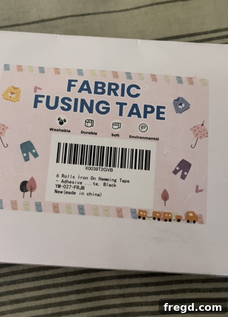 Using fabric tape and an iron to hem the raw edges of the fabric cover