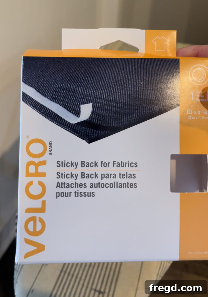 Applying sticky-back velcro to the fabric cover