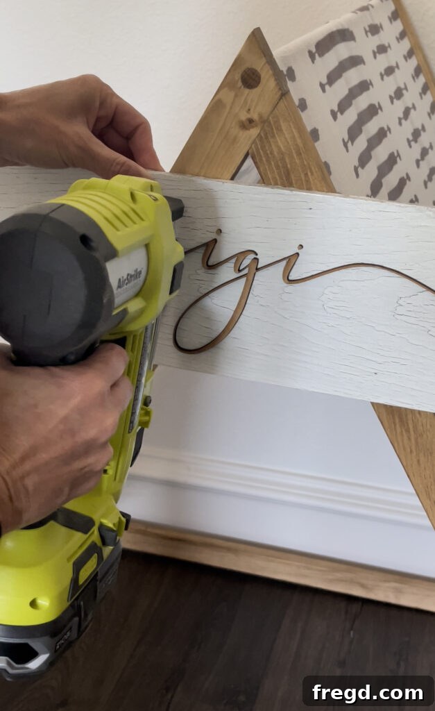 Custom sign made with Glowforge and attached with a Ryobi Pin Nailer