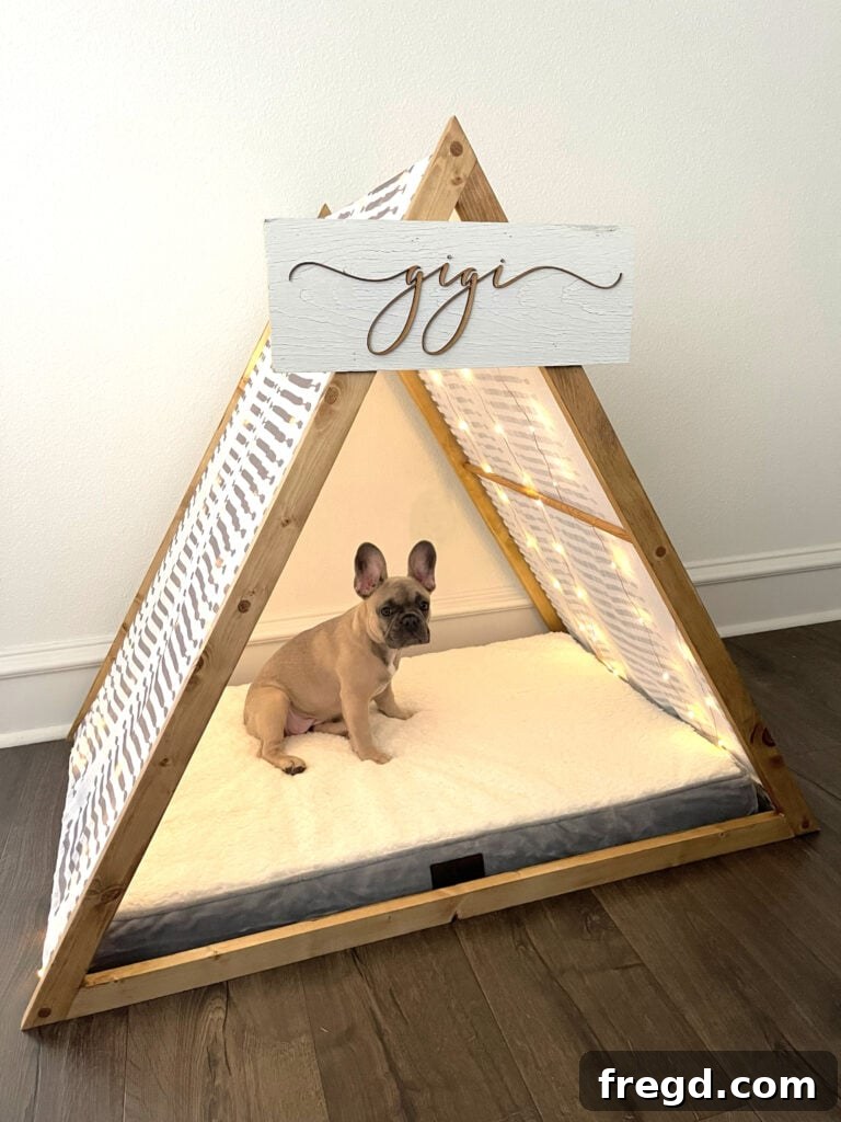 Medium-sized memory foam dog pillow placed inside the finished doghouse bed