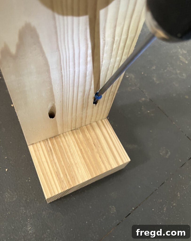 Craft Your Seven-Board Coffee Table 4 Attaching breadboards to coffee table leg pieces with wood glue and 2 1/2-inch pocket hole screws, flush at top and 3 inches from bottom.