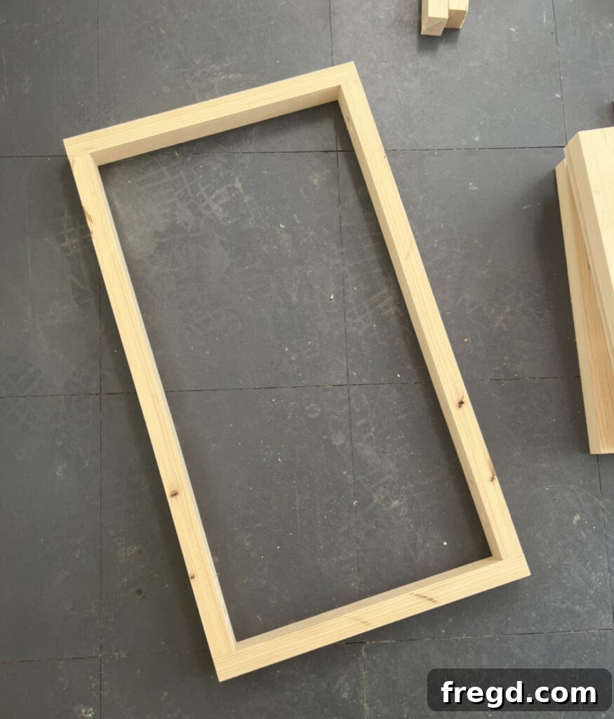 Craft Your Seven-Board Coffee Table 7 Close-up view of a Kreg Jig pocket hole joint on an apron frame piece, demonstrating clean joinery.