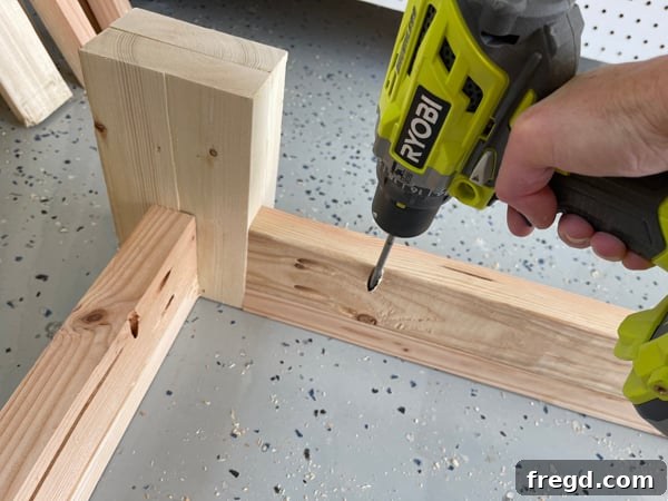 Craft Your Sleep Haven: DIY Bed Frame and Timber Headboard 15 Attaching side rails to trim and feet