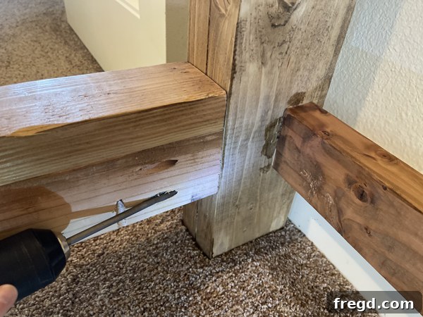 Craft Your Sleep Haven: DIY Bed Frame and Timber Headboard 16 Attaching bed frame to headboard