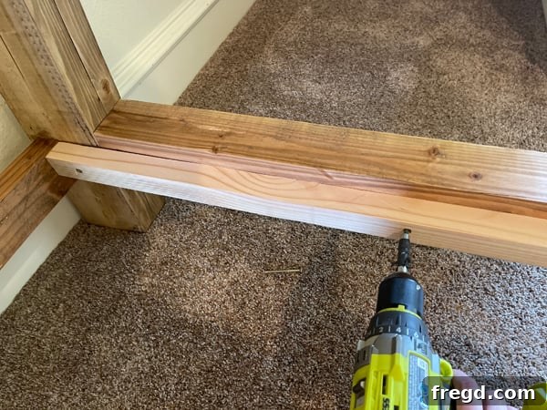 Craft Your Sleep Haven: DIY Bed Frame and Timber Headboard 17 Attaching mattress support cleats