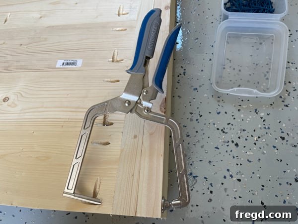 Craft Your Sleep Haven: DIY Bed Frame and Timber Headboard 7 Kreg Right Angle Clamp in use