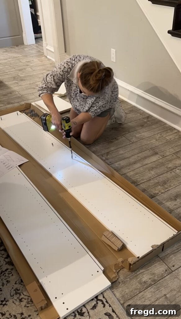 Assembling an IKEA Billy bookcase inside a small cleaning closet