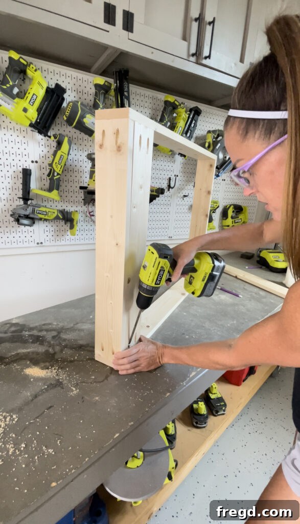 Elevate Your Bathroom with DIY Mirrored Storage 5 Showing the attachment of back cleats to the cabinet frame, ensuring pocket holes face the rear.
