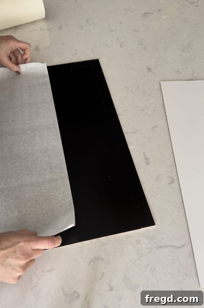 Glowforge in action, cutting masked whiteboard material