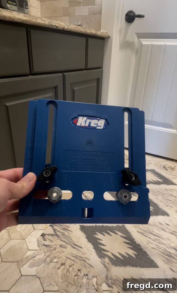 Kreg Hardware Jig clamped to a cabinet door