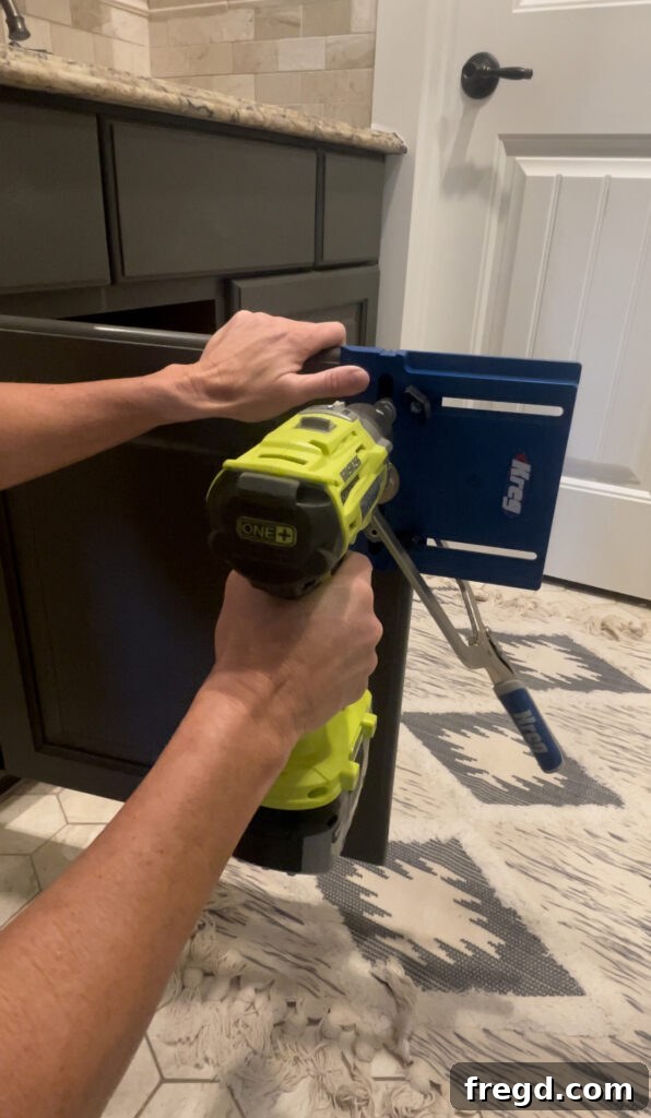 Drilling holes for cabinet hardware using the jig