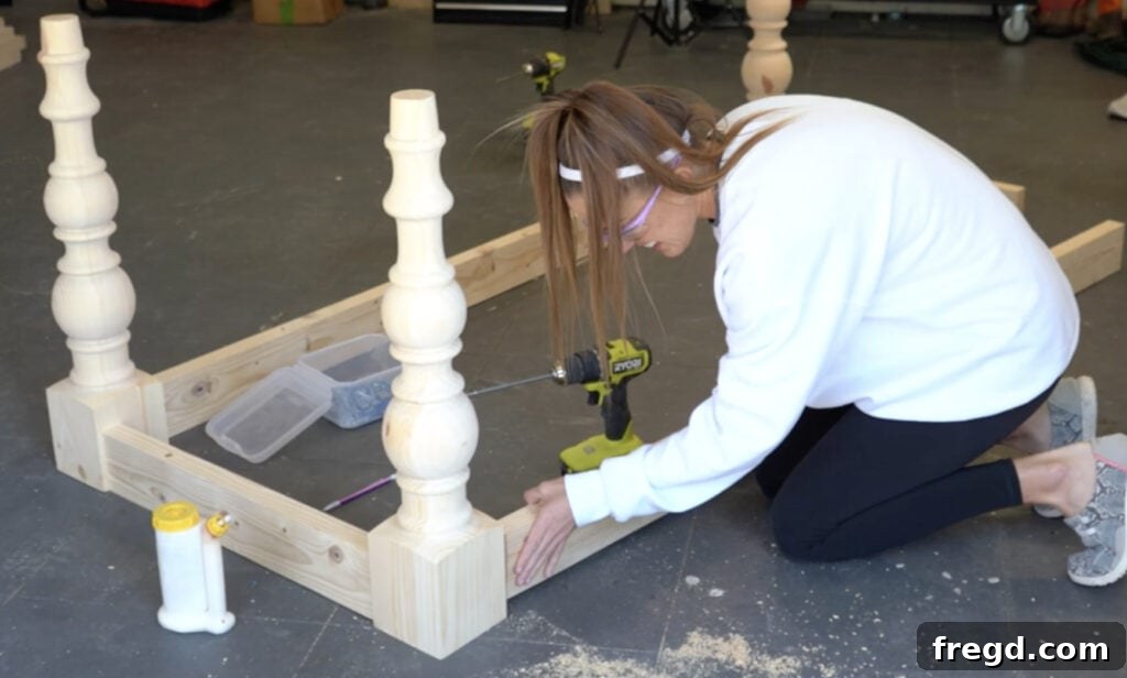 Handcrafted Farmhouse Dining Table with Elegant Turned Legs 11 Attaching the long apron board to the leg assembly
