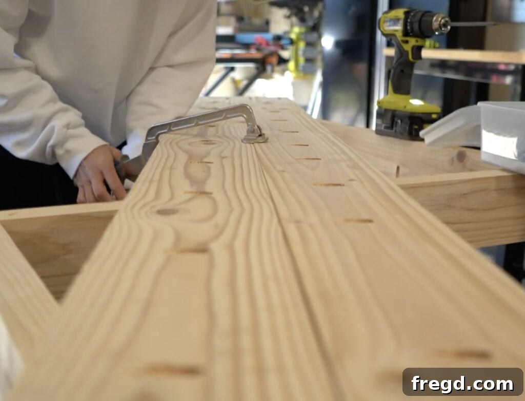 Handcrafted Farmhouse Dining Table with Elegant Turned Legs 13 Using a Kreg Face Clamp during tabletop assembly