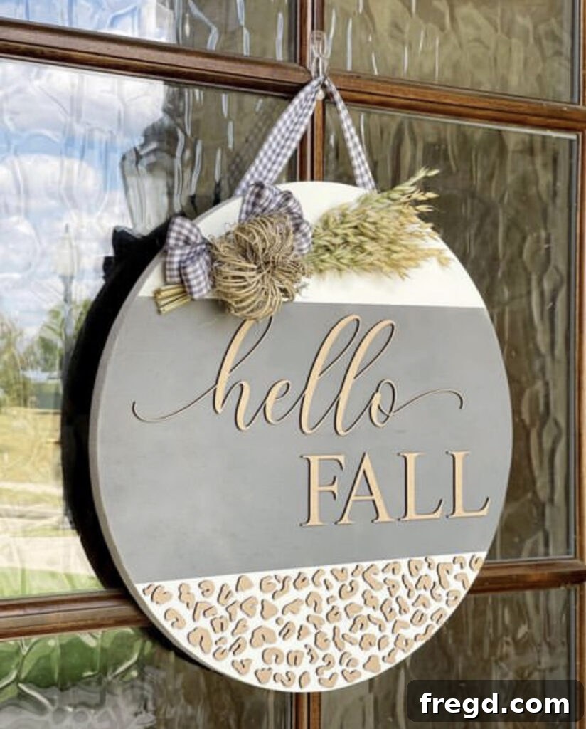 Custom door hanger with intricate laser-cut design made using Glowforge.