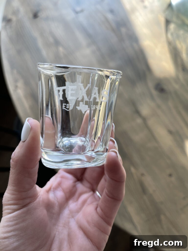 Shot glass with a detailed laser-engraved design, ideal for custom drinkware.