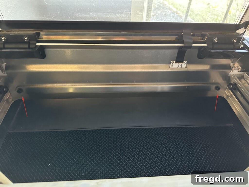 Detail shot of the back plate screws on a Glowforge Pro, essential for using the passthrough feature.