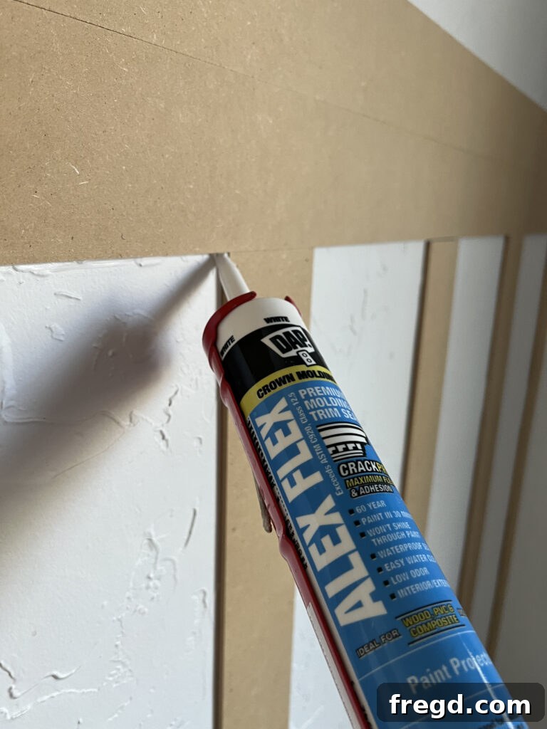 Transform Your Home with DIY Board and Batten Paneling 11 Close-up view of smoothed caulk lines, demonstrating a professional finish ready for painting.