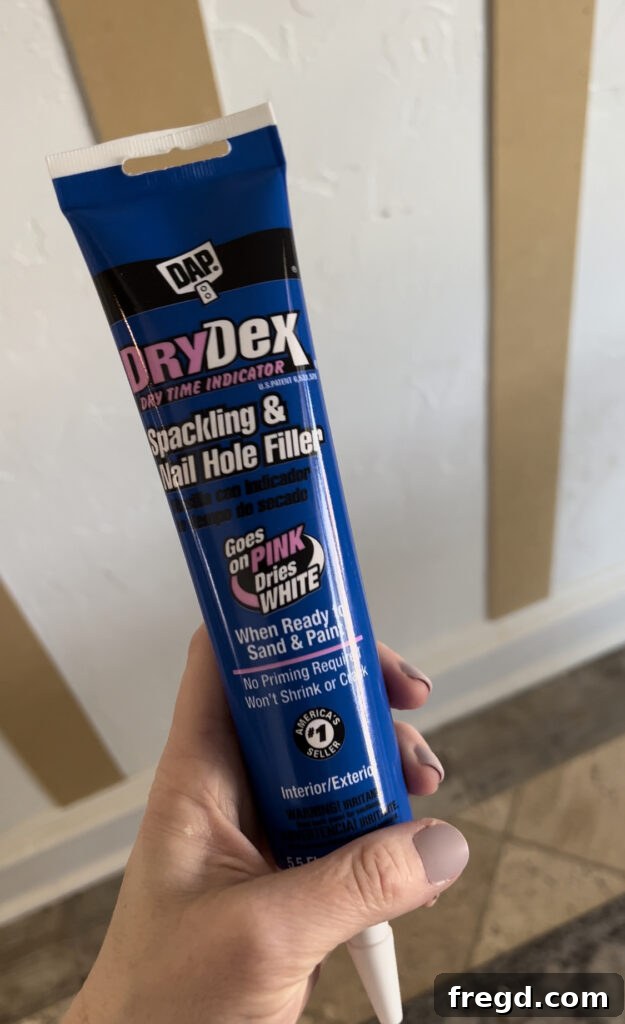 Transform Your Home with DIY Board and Batten Paneling 12 Filling small nail holes on the bender boards with spackling paste to achieve a smooth, unblemished surface.