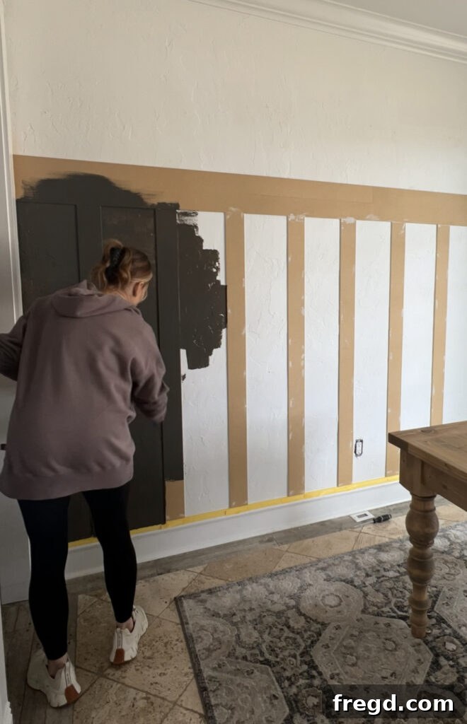 Transform Your Home with DIY Board and Batten Paneling 14 Close-up of the painted board and batten wall, showcasing the smooth flat finish after all preparation steps.