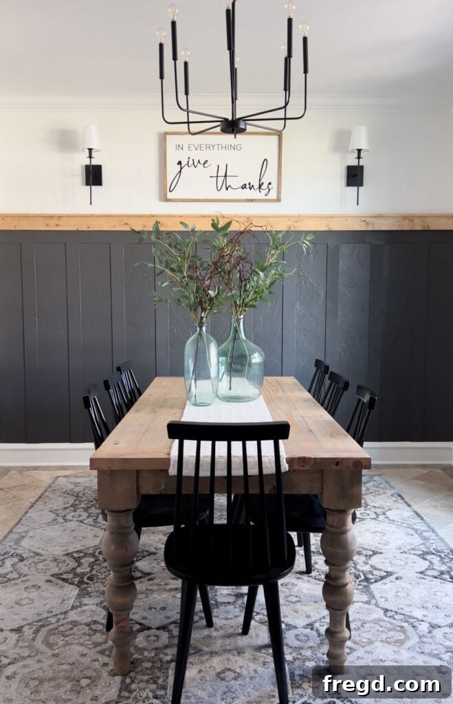 Transform Your Home with DIY Board and Batten Paneling 17 Full view of the completed DIY board and batten wall in the dining room, showcasing the modern aesthetic and cozy ambiance.
