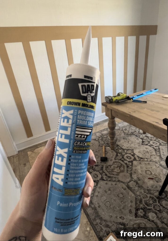 Transform Your Home with DIY Board and Batten Paneling 10 Applying paintable caulk along the seams where bender boards meet the wall and other boards.