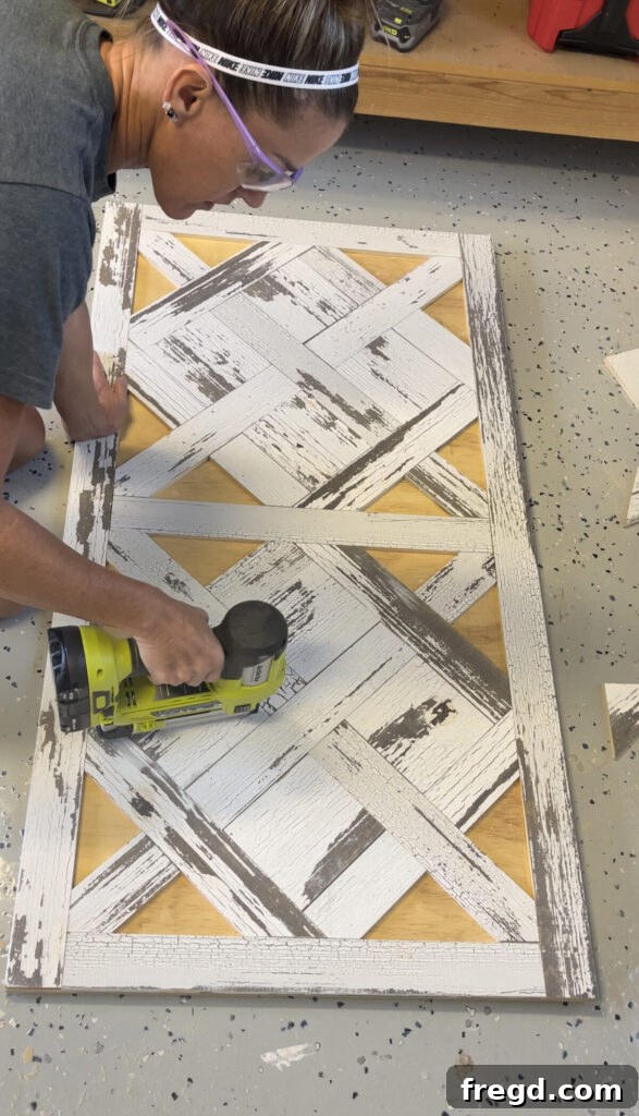 Square wood pieces being measured, cut, and carefully placed to complete sections of the parquet table top design.