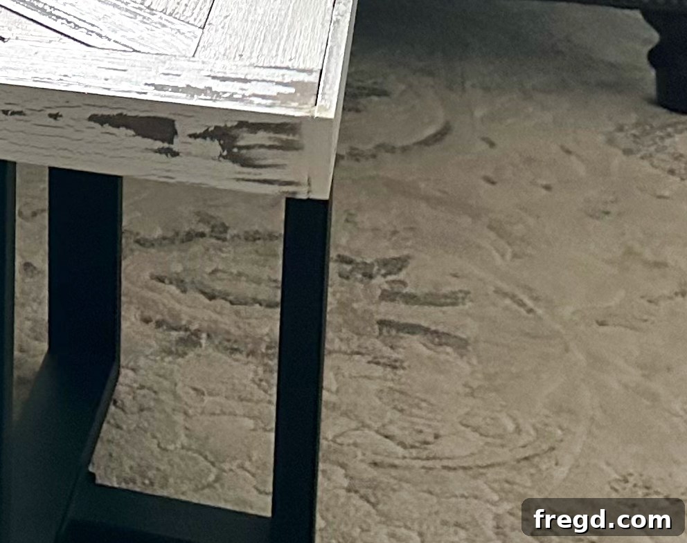 A close-up of the completed coffee table showing the rustic barn wood parquet top, ready for final finishing.