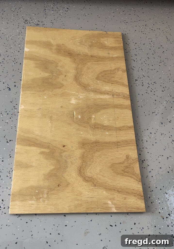 A half-inch hardwood plywood sheet being cut to the precise dimensions needed for the coffee table top base.