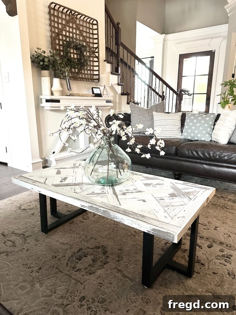 Detailed shot of the coffee table's parquet pattern, highlighting the texture and character of the reclaimed barn wood.