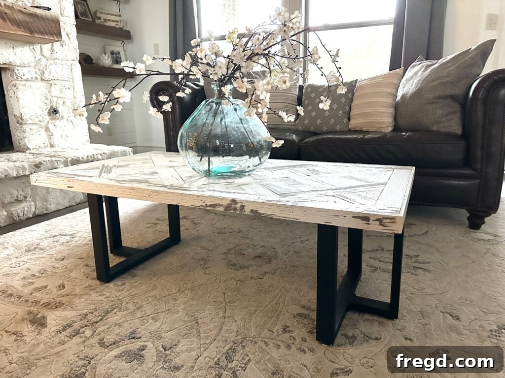The coffee table from a different angle, showcasing its robust construction and elegant form in a home setting.