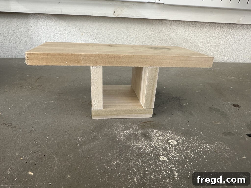 Craft Your Custom Countertop Spice Organizer 4 The assembled end piece being centered and attached to a longer base board.