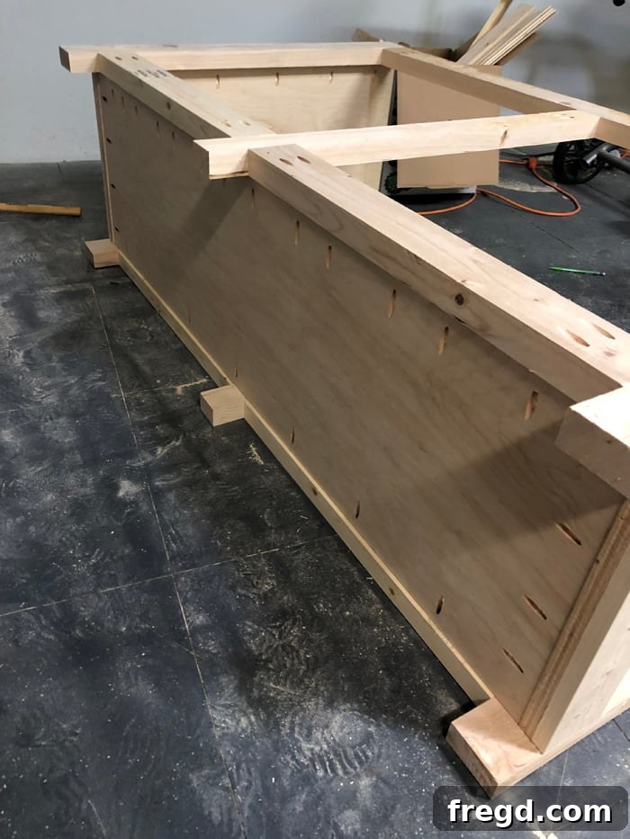 Build Your Own Elegant Buffet Table 15 Front view of the buffet cabinet's main frame, showcasing both the front and back face frames securely attached to the side panels and middle divider.